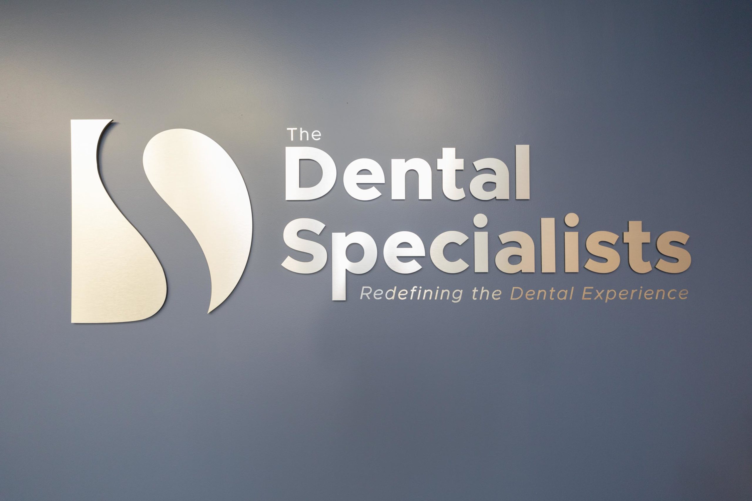 The Dental Specialists wall sign in the Newton office