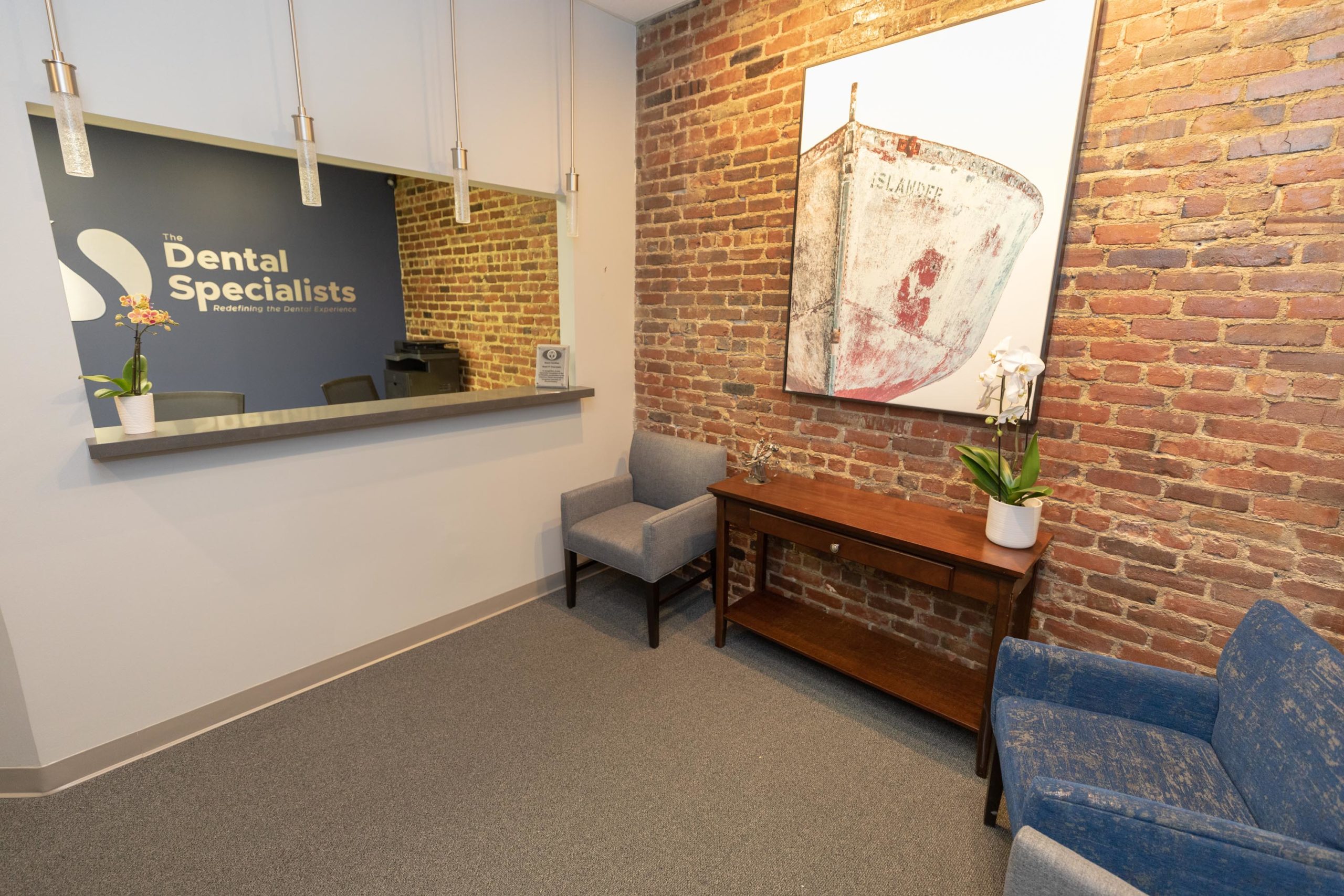 Reception area with exposed brick at The Dental Specialists