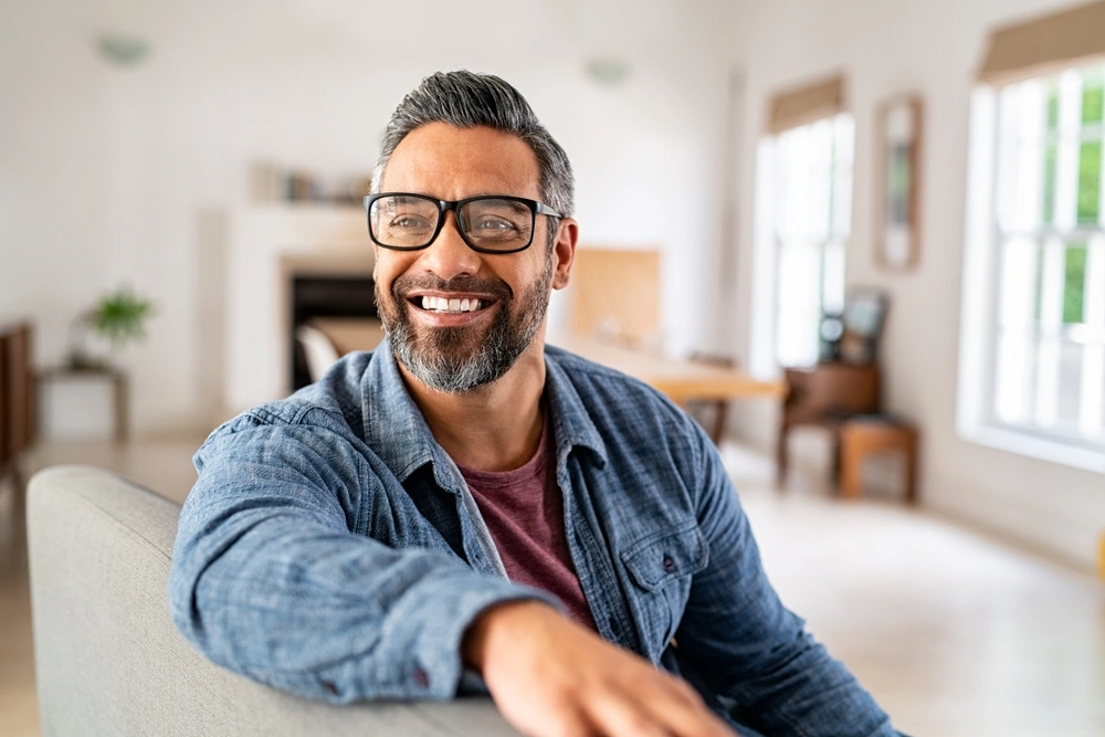 Smiling patient seated at home