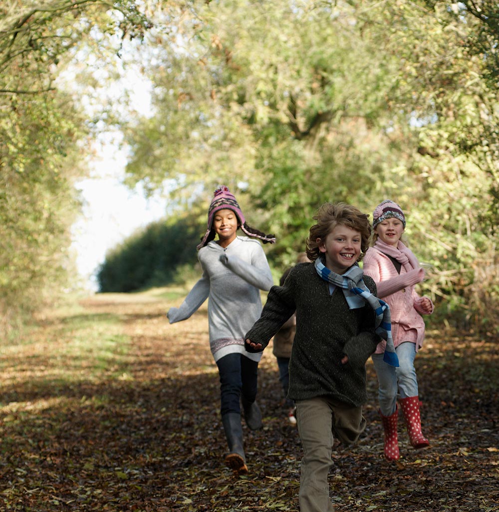Children running down a country lane